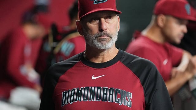 Arizona Diamondbacks manager Torey Lovullo watches his team from the dugout as they play the Seattle Mariners at Chase Field in Phoenix on June 10, 2025.