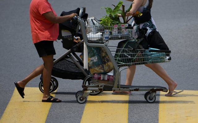 A shopper pushes a shopping carts as they leave a Real Canadian Superstore in Ottawa on Tuesday, June 25, 2024. THE CANADIAN PRESS/Sean Kilpatrick