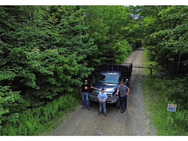  Three generations of Hebbs, from left, Buddy, Amos and Reuben Hebb, stand on what Buddy referred to as the head of Hebb Road, near Lower Vaughan on Monday.