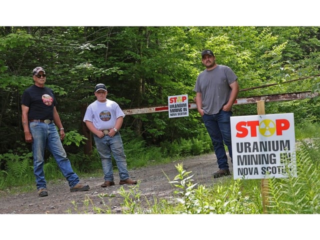 Three generations of Hebbs, from left, Buddy, Amos and Reuben Hebb, stand on what Buddy referred to as the head of Hebb Road, near Lower Vaughan on Monday.