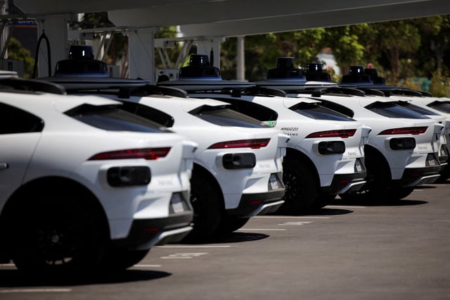 Waymo driverless vehicles charge at a Waymo charging station in Santa Monica, California, U.S., May 30, 2025. REUTERS/Daniel Cole/File Photo