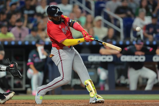 MIAMI, FLORIDA - JUNE 21: Marcell Ozuna #20 of the Atlanta Braves hits a single against the Miami Marlins during the fifth inning at loanDepot park on June 21, 2025 in Miami, Florida.