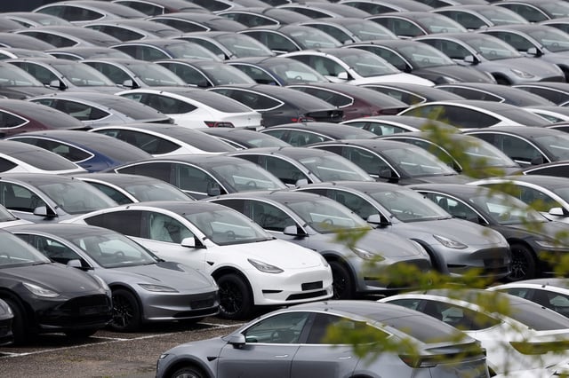 Tesla electric vehicles are pictured at one of the company's delivery centers in Valenton, near Paris, France, April 24, 2025. REUTERS/Benoit Tessier/File Photo