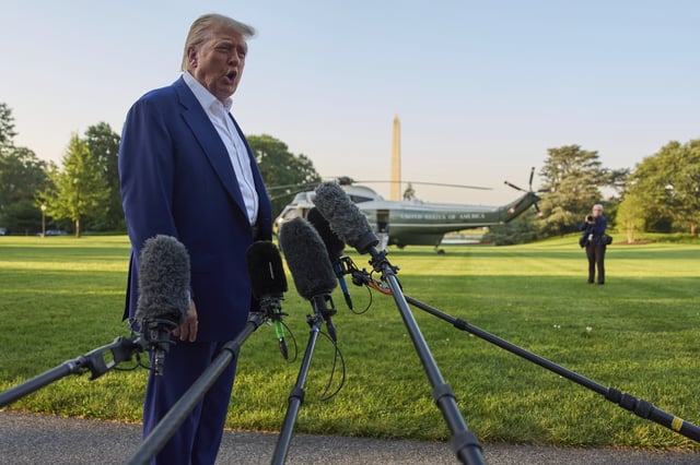 President Donald Trump speaks with reporters before boarding Marine One on the South Lawn of the White House, Tuesday, June 24, 2025, in Washington. (AP Photo/Evan Vucci)
