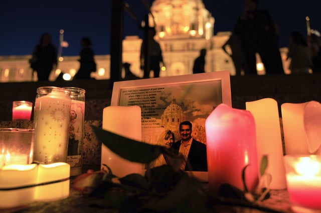 A candlelight vigil for former House Speaker Melissa Hortman and her husband Mark, who were fatally shot, at the state Capitol, Wednesday, June 18, 2025, in St. Paul, Minn. (AP Photo/Nikolas Liepins)