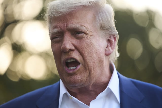 President Donald Trump speaks with reporters before boarding Marine One on the South Lawn of the White House, Tuesday, June 24, 2025, in Washington. (AP Photo/Evan Vucci)