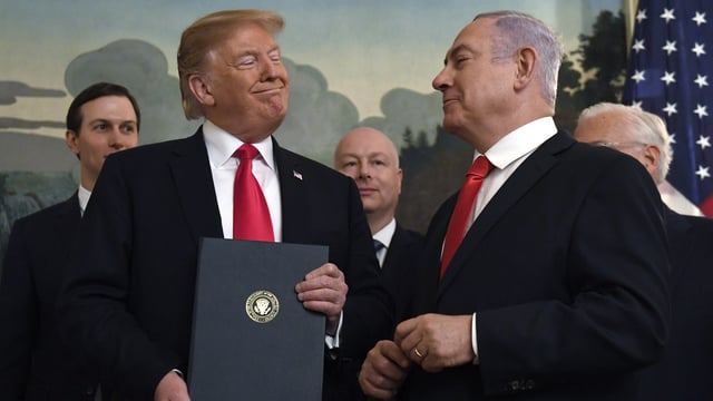 In this March 25, 2019 file photo, President Donald Trump is seen with Israeli Prime Minister Benjamin Netanyahu