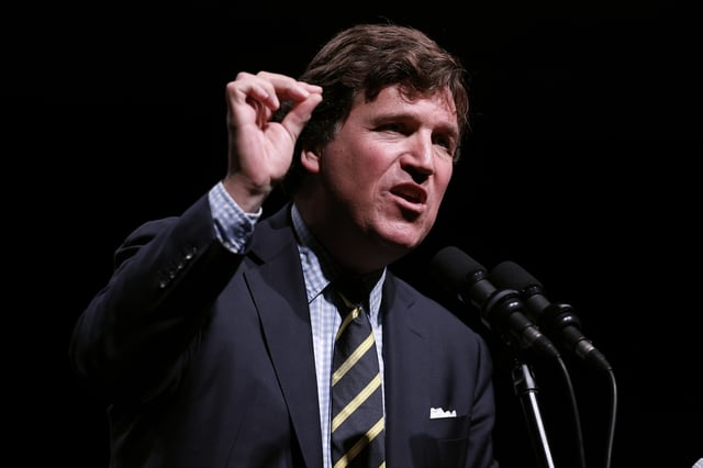 Tucker Carlson speaks at his Live Tour at the Desert Diamond Arena on October 31, 2024 in Phoenix, Arizona.
