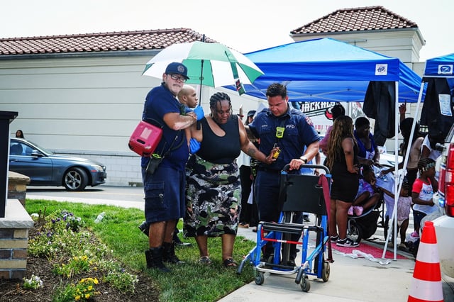 EMS personal assist a women after the Paterson Public Schools graduation at Hinchliffe Stadium, Jun 23, 2025, in Paterson, N.J.