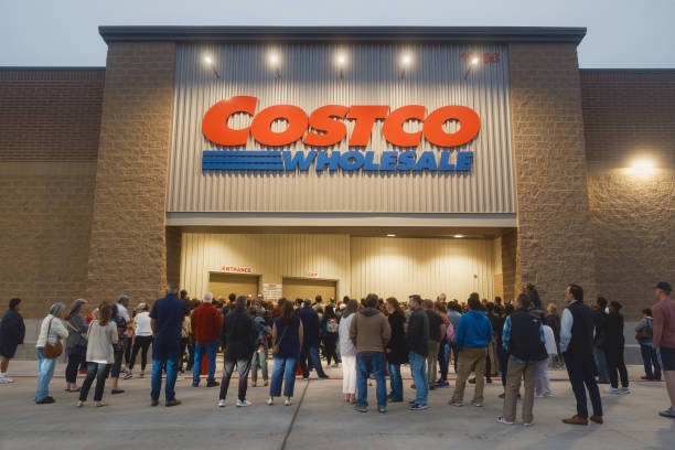 Customers line up to enter during the grand opening of a Costco Wholesale store in Kyle, Texas, on Thursday, March 30, 2023. 