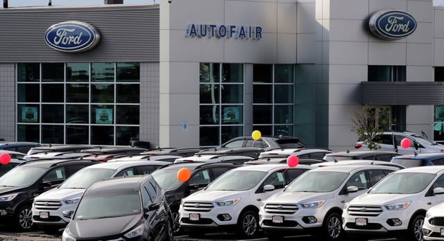 In this Thursday, Aug. 15, 2019 file photo, cars are seen for sale at the Ford dealership in Manchester, N.H.