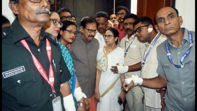 West Bengal chief minister Mamata Banerjee meets the assembly marshals allegedly injured during a scuffle with BJP legislators during the monsoon session in Kolkata on Tuesday. (ANI)