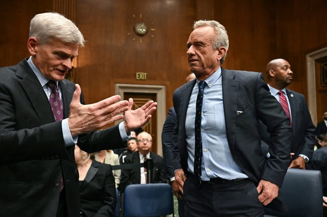 US Secretary of Health and Human Services Robert F. Kennedy Jr., (R) speaks with committee chairman Senator Bill Cassidy, Republican from Louisiana, before the start of a Senate Committee on Health, Education, Labor, and Pensions hearing on the President's proposed budget request for fiscal year 2026 for the Department of Health and Human Services, on Capitol Hill in Washington, DC, May 14, 2025.