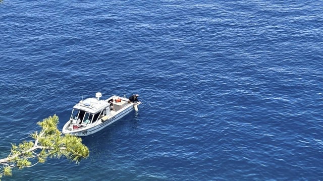 Authorities conduct searches along the shore at D.L. Bliss State Park after a weekend incident in which a boat capsized, killing several people, on Monday, June 23, 2025, in South Lake Tahoe.