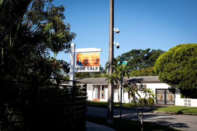 A "For Sale" sign stands at a house in Miami, Florida, U.S. April 16, 2025.
