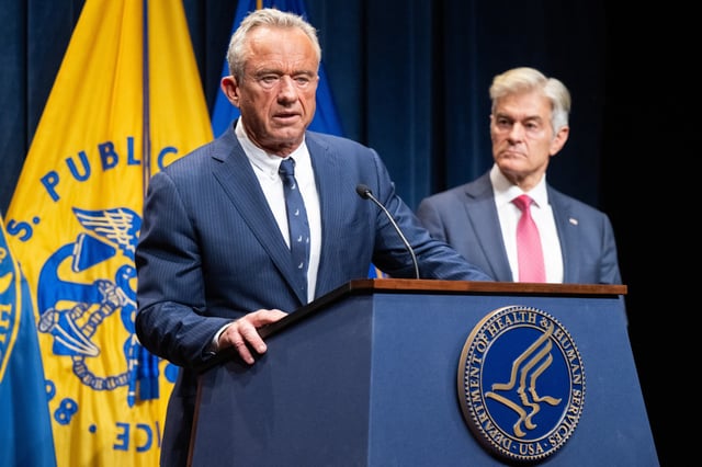 Medicare and Medicaid Administrator Mehmet Oz, right, listens to Secretary of Health and Human Services Robert F. Kennedy Jr. speak during a news conference to discuss health insurance at the Department of Health and Human Services Headquarters in Washington, DC, on June 23, 2025.