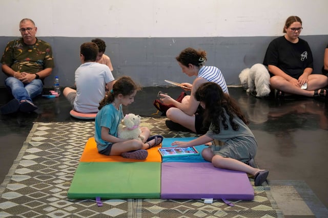 Israelis and pets seek shelter together amid escalating Iran conflict