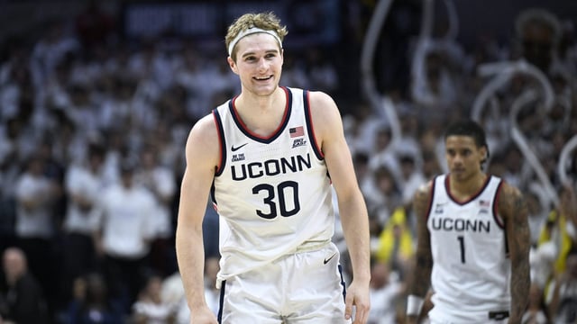 UConn forward Liam McNeeley (30) smiles in the second half of an NCAA college basketball game against Baylor, Wednesday, Dec. 4, 2024, in Storrs, Conn. (AP Photo/Jessica Hill)