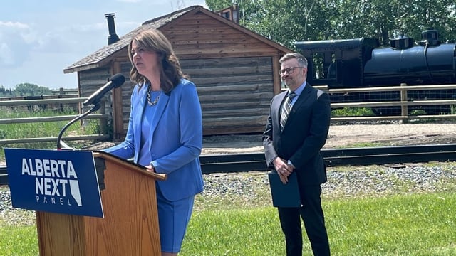 Alberta Premier Danielle Smith announced the composition of her 'Alberta Next' panel at Heritage Park in Calgary on Tuesday. Adam Legge of the Business Council of Alberta watches at right.