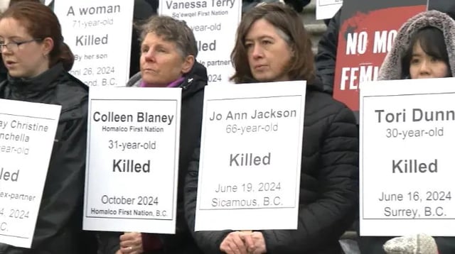 Advocates hold signs bearing the names of women killed in British Columbia on the steps of the B.C. legislature on the International Day for the Elimination of Violence Against Women on Nov. 25, 2024.
