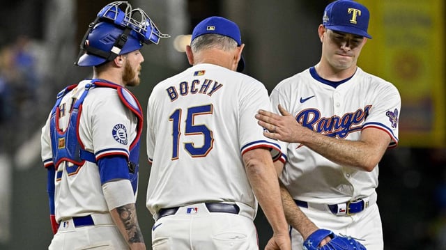 Texas Rangers manager Bruce Bochy (15) takes starting pitcher Cody Bradford (61) out of a game.