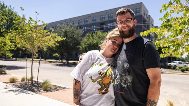The Cooper Apartments residents Astrid and Luke Walsh are photographed outside their apartment building on Tuesday, June 24, 2025, following a six-alarm fire Monday in Near Southside Fort Worth. The Walshes have lived in The Cooper for four years and plan to move elsewhere once everything is resolved.