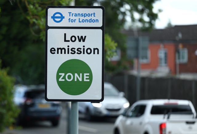A road users information sign is seen at the new extended boundary of London's Ultra Low Emissions Zone (ULEZ) zone, in Ickenham, outer London, Britain, August 22, 2023. REUTERS/Toby Melville/File Photo