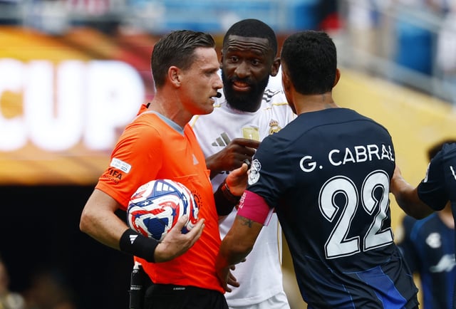 Soccer Football - FIFA Club World Cup - Group H - Real Madrid v Pachuca - Bank of America Stadium, Charlotte, North Carolina, U.S. - June 22, 2025, Real Madrid's Antonio Rudiger and Pachuca's Gustavo Cabral remonstrate with referee Ramon Abatti REUTERS/Susana Vera/File Photo