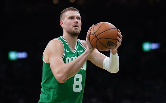 May 7, 2025; Boston, Massachusetts, USA; Boston Celtics center Kristaps Porzingis (8) shoots a free throw against the New York Knicks in the second half during game two of the second round for the 2025 NBA Playoffs at TD Garden. Mandatory Credit: David Butler II-Imagn Images/File Photo