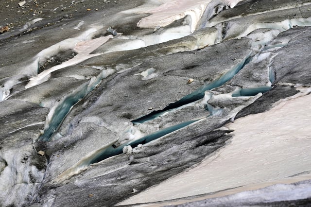 A lake of meltwater has formed on the tongue of the Rhone Glacier near Goms, Switzerland, June 10, 2025. (AP Photo/Matthias Schrader)