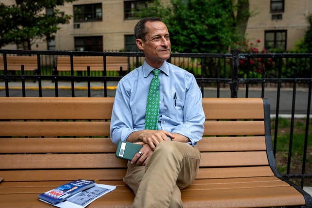 Anthony Weiner takes a break while campaigning for a seat on the New York City Council at building in the Lower East Side, Thursday, May 29, 2025, in New York. (AP Photo/Angelina Katsanis)