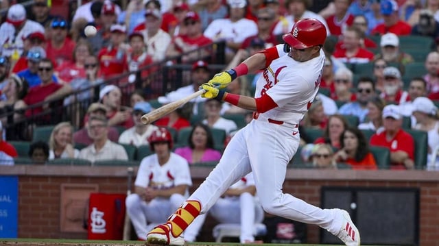 Jun 24, 2025; St. Louis, Missouri, USA;  St. Louis Cardinals left fielder Lars Nootbaar (21) hits a two run home run against the Chicago Cubs during the second inning at Busch Stadium. Mandatory Credit: Jeff Curry-Imagn Images