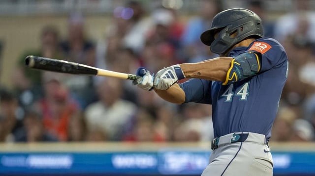 Mariners slugger Julio Rodriguez drives in the game-winning run during the ninth inning of a 6-5 victory over the Twins on Tuesday.