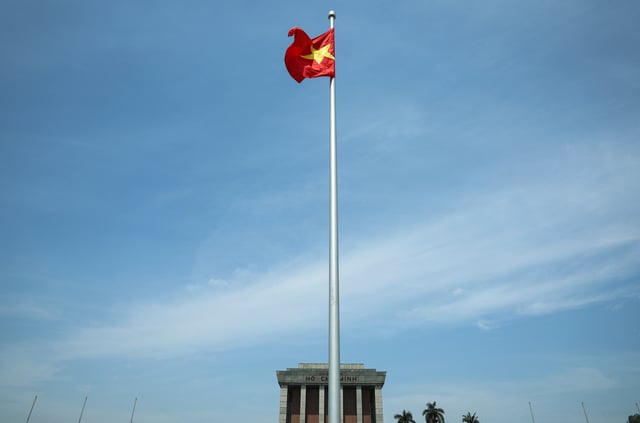 A Vietnamese flag flutters on the day Chinese President Xi Jinping visits the Ho Chi Minh Mausoleum during his visit to Hanoi, Vietnam, April 15, 2025. REUTERS/Athit Perawongmetha/Pool/File Photo