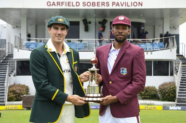 Captains Pat Cummins (left) of Australia and Roston Chase of the West Indies pose with the Frank Worrell trophy ahead of the first Test at Kensington Oval, Bridgetown, Barbados