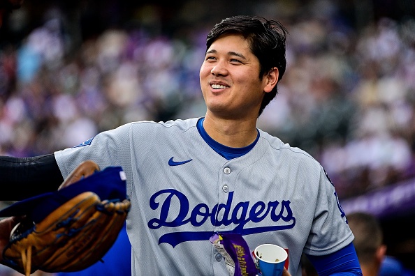 DENVER, CO – JUNE 24: Los Angeles Dodgers designated hitter Shohei Ohtani (17) welcomes a teammate to the dugout after a defensive half inning during a game between the Los Angeles Dodgers and the Colorado Rockies at Coors Field on June 24, 2025 in Denver, Colorado. (Photo by Dustin Bradford/Icon Sportswire via Getty Images)