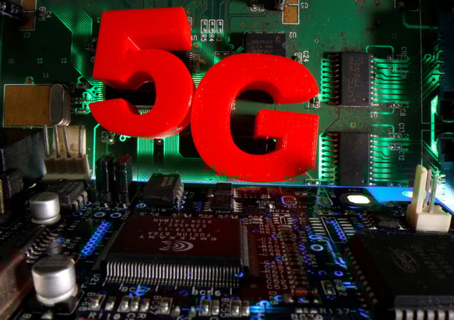 3d printed objects representing 5G are put on a motherboard in this picture illustration taken April 24, 2020. REUTERS/Dado Ruvic /Illustration/File Photo
