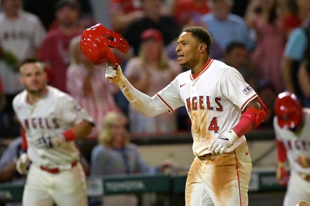 The Angels’ Christian Moore, center, celebrates after hitting a two-run, walk-off home run in the 10th inning of their game against the Boston Red Sox on Tuesday night at Angel Stadium. Moore also hit a game-tying homer in the eighth in the 3-2 win. (AP Photo/Jayne Kamin-Oncea)