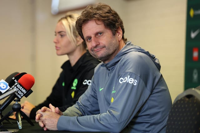 Joe Montemurro, coach of the Matildas looks on while talking to the media with Ellie Carpenter.