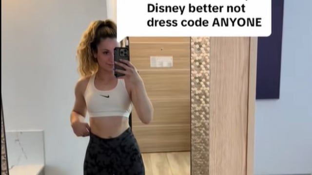 A woman shamed for wearing a sports bra to Disney World hits back at critics.