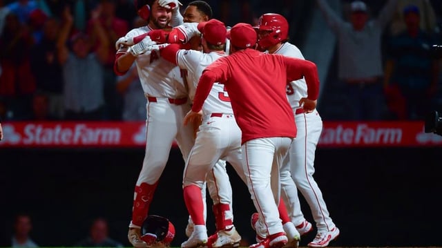 Jun 24, 2025; Anaheim, California, USA; Los Angeles Angels celebrate the two run walk off home run of second baseman Christian Moore (4) against the Boston Red Sox for the victory at Angel Stadium. Mandatory Credit: Gary A. Vasquez-Imagn Images