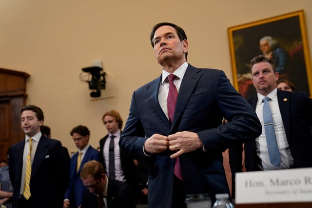 U.S. Secretary of State Marco Rubio buttons his jacket at the start of a House Foreign Affairs Committee hearing on U.S. President Donald Trump's State Department budget request for the Department of State, on Capitol Hill in Washington, D.C., U.S., May 21, 2025. REUTERS/Elizabeth Frantz/File Photo