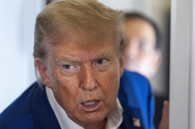 President Donald Trump speaks with reporters on Air Force One while in flight from Joint Base Andrews, Md., to Amsterdam, Netherlands, Tuesday, June 24, 2025.