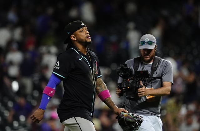 Jun 21, 2025; Denver, Colorado, USA; Arizona Diamondbacks second baseman Ketel Marte (4) looks on following the win against the Colorado Rockies at Coors Field. Mandatory Credit: Ron Chenoy-Imagn Images/File Photo