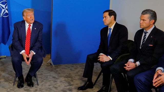 U.S. President Donald Trump speaks as US Secretary of Defense Pete Hegseth and US Secretary of State Marco Rubio sit, at the NATO summit in The Hague, Netherlands, June 25, 2025. REUTERS/Brian Snyder