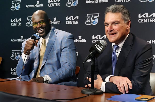 Alex Martins, right, was the media relations director when Shaquille O’Neal played for the Magic and the CEO during this press conferfence when Shaq&#39;s jersey was retired last year.  (Stephen M. Dowell/Orlando Sentinel)
