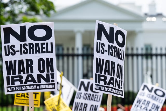 Anti-war activists protest outside the White House on June 22, the day after the Trump administration launched airstrikes against Iran. (Bill Clark/CQ Roll Call)