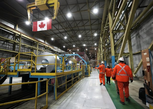 Deloitte Canada expects the Canadian economy will hit a recession in 2025, but may avoid the worst-case outcome. Steel workers work at the ArcelorMittal Dofasco steel plant in Hamilton, Ont., on Wednesday, March 12, 2025. THE CANADIAN PRESS/Nathan Denette