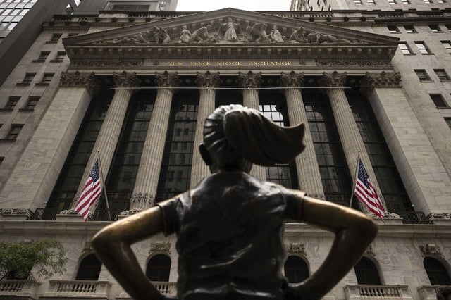 The "Fearless Girl" statue stands in front of the New York Stock Exchange, Wednesday, June 18, 2025, in New York.