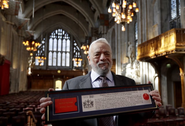 FILE -American multi-award-winning composer and lyricist, Stephen Sondheim poses with his framed 'Copy of Freedom', after being awarded the Freedom of the City of London at a ceremony at the Guildhall in London, Sept. 27, 2018. (AP Photo/Kirsty Wigglesworth, File)